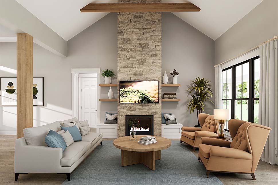 Interior of Plan 82919 great room with vaulted ceiling, exposed beams, fireplace, and open flow to kitchen and dining area