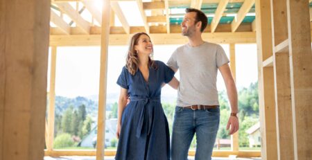 Excited Couple Inspecting their home which is under construction