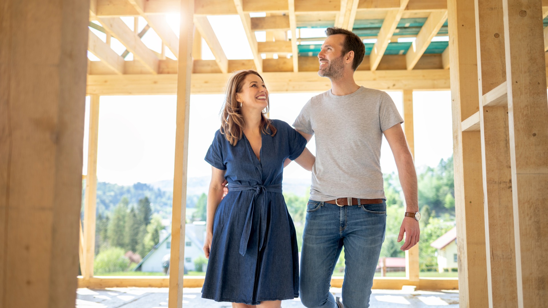 Excited Couple Inspecting their home which is under construction