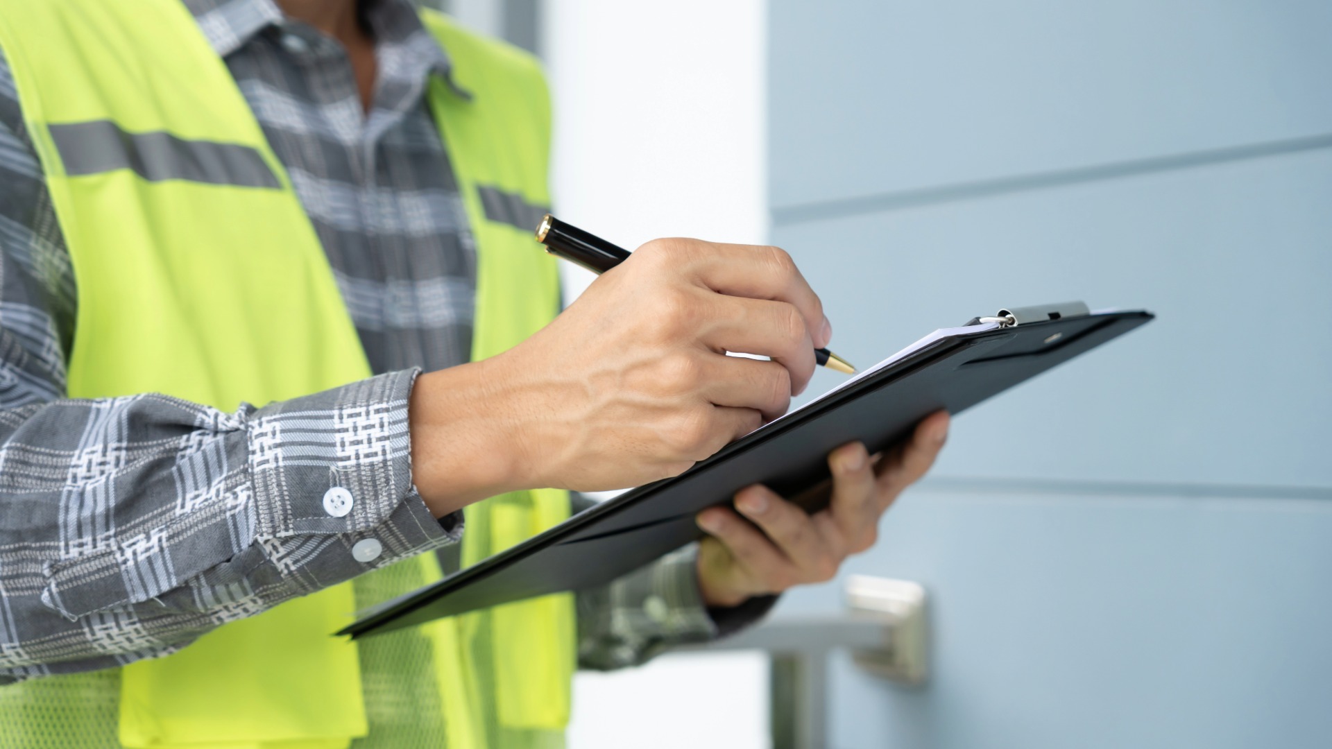 Construction inspector checking progress before releasing loan funds