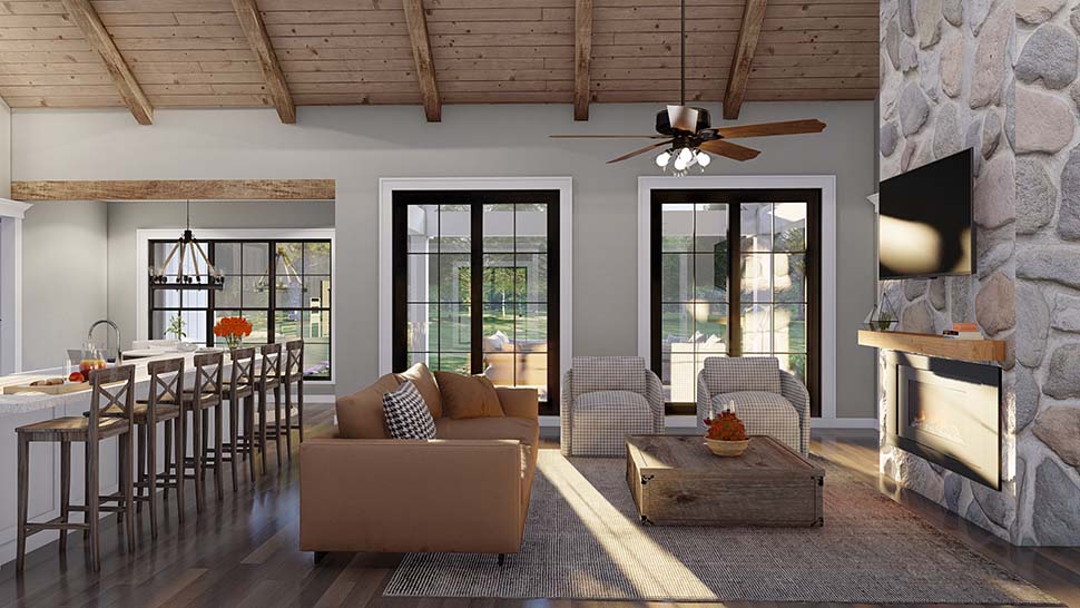 Vaulted great room in Farmhouse Plan 100410 featuring faux beams, brick fireplace, and open connection to kitchen and breakfast area