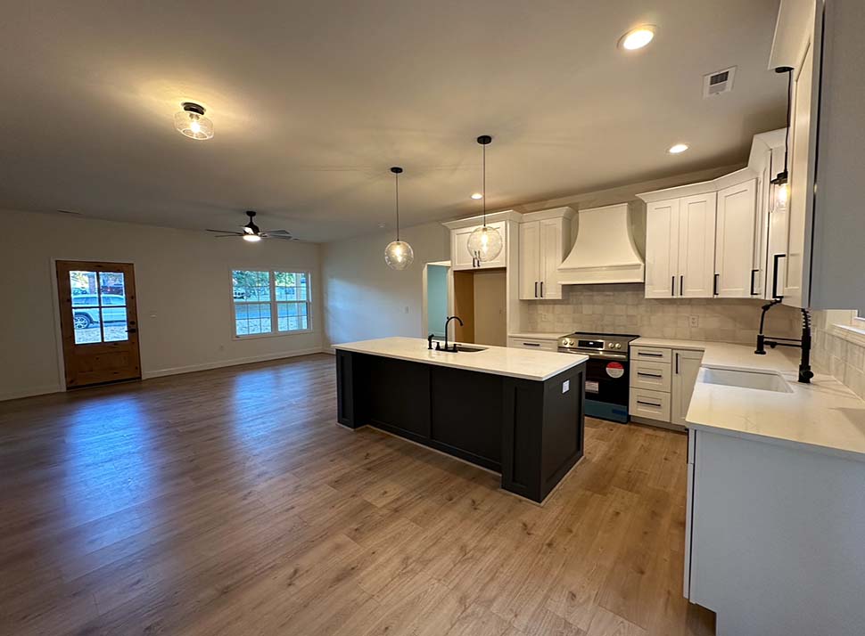 Kitchen interior of Country Ranch Style House Plan 77435 with large island and open concept design