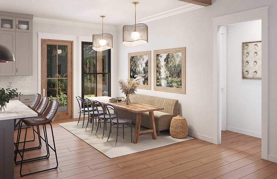 Dining area of Traditional House Plan 82935 with open connection to kitchen and rear porch