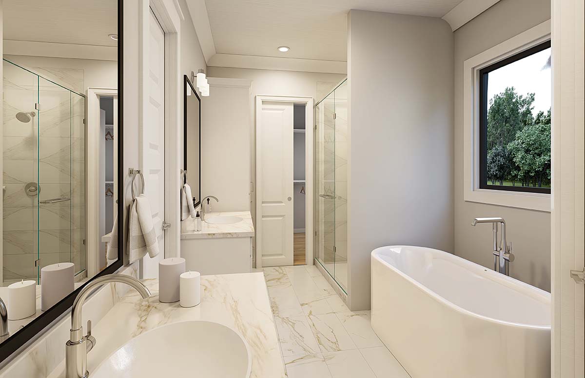 Primary bathroom interior of Barndominium House Plans 84712 with luxury finishes and large walk in closet access
