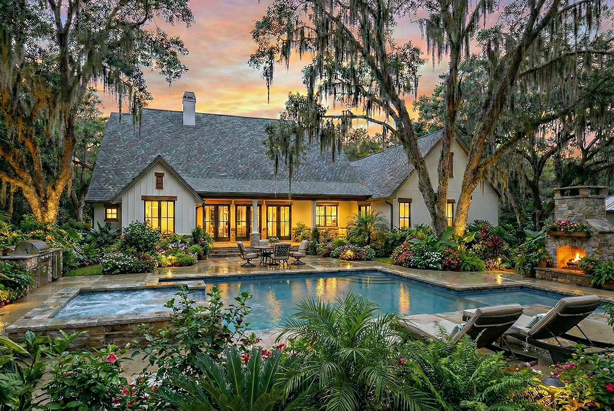 Rear elevation of Modern Farmhouse Plan 75180 with covered porch and large rear windows